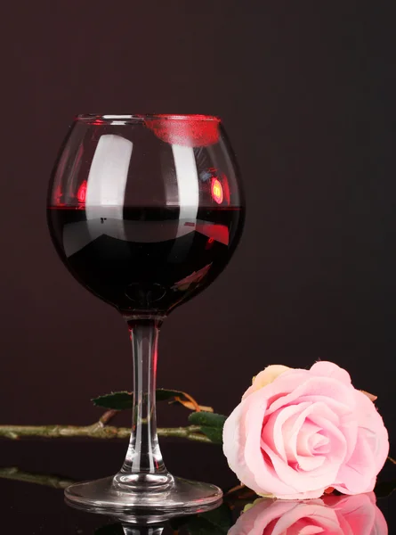 Glass of wine with lipstick imprint on dark background — Stock Photo, Image