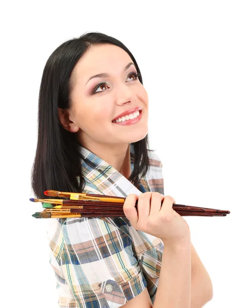 Beautiful young woman painter with brushes, isolated on white — Stock Photo, Image