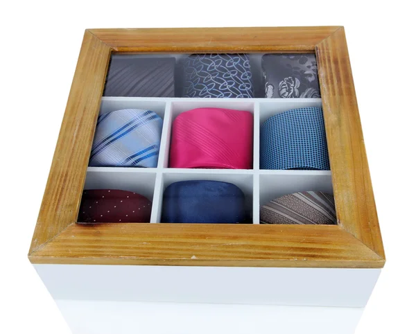 Neckties in wooden box isolated on white — Stok fotoğraf