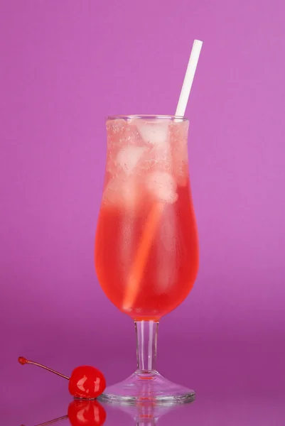Cherry cocktail with ice on purple background — Stock Photo, Image