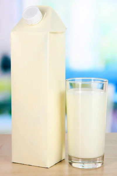 Milk pack on table in kitchen — Stock Photo, Image