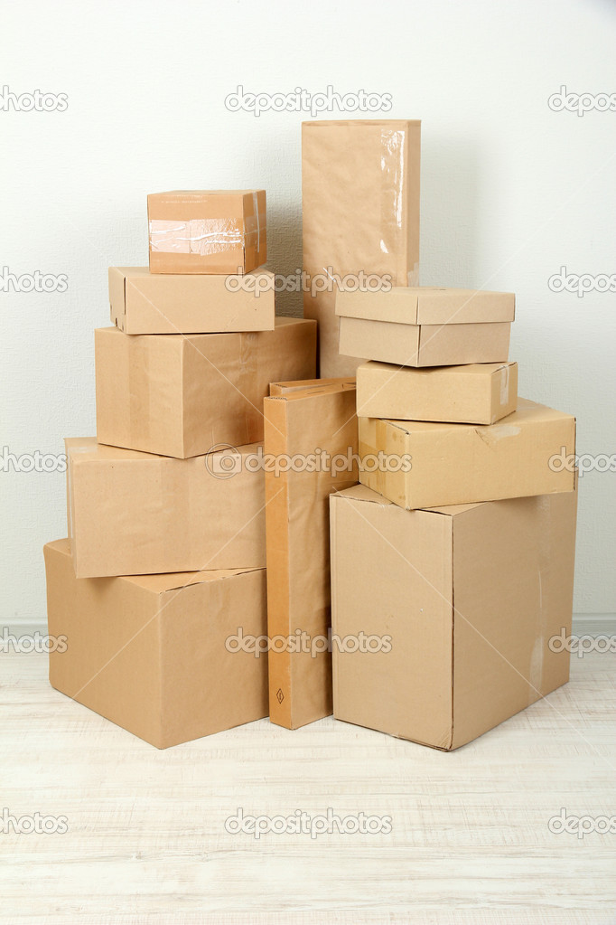 Different cardboard boxes in room