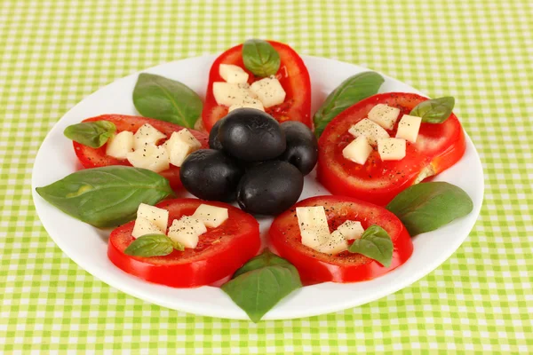 Cheese mozzarella with vegetables in plate on table — Stock Photo, Image