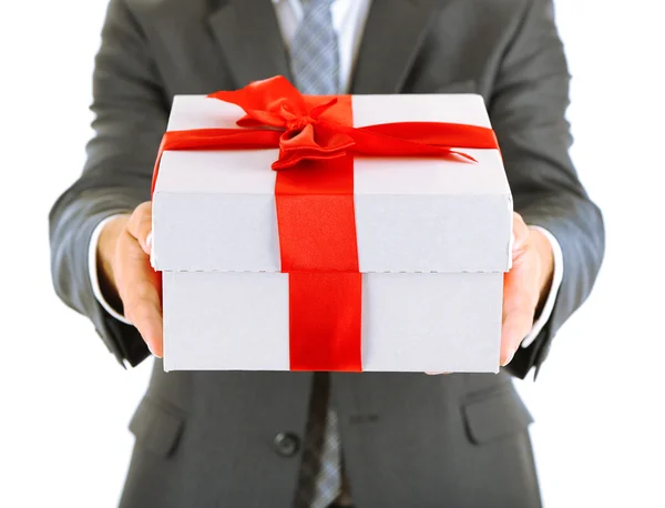 Young businessman present gift box, isolated on white — Stock Photo, Image