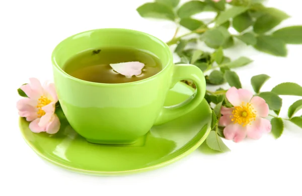 Cup of herbal tea with hip rose flowers, isolated on white — Stock Photo, Image