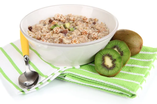 Harina de avena útil en tazón con fruta aislada en blanco — Foto de Stock