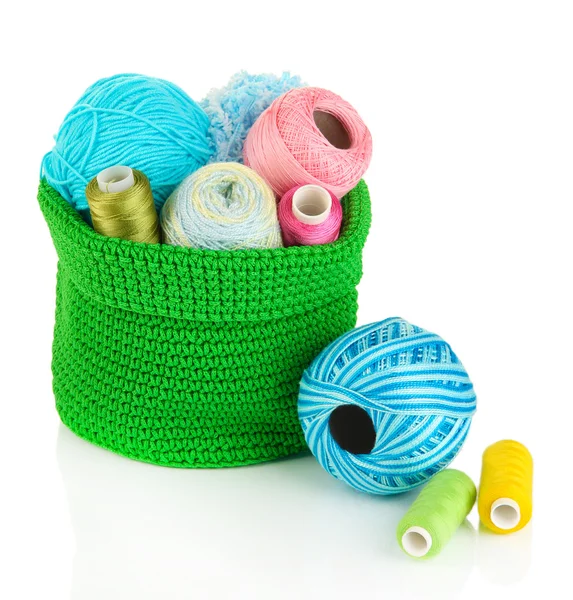 Colorful yarn for knitting in green basket isolated on white — Stock Photo, Image