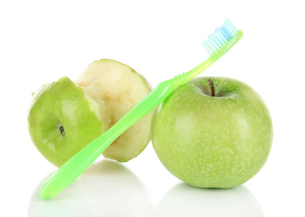 Maçãs com uma escova de dentes isolada em branco — Fotografia de Stock