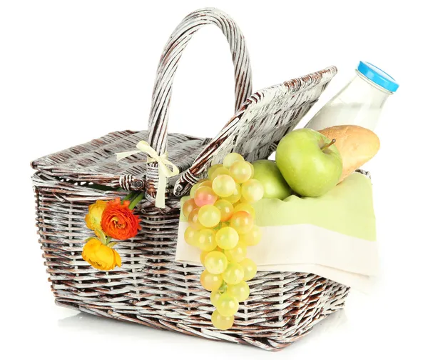 Picnic basket with fruits and bottle of milk, isolated on white — Stock Photo, Image