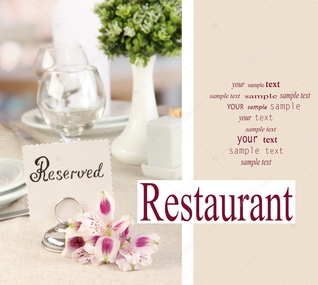 Reserved sign on restaurant table with empty dishes and glasses