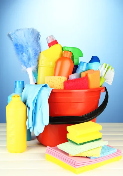 Cleaning items in bucket on color background — Stock Photo, Image