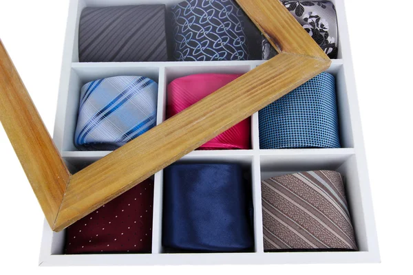 Neckties in wooden box isolated on white — Stok fotoğraf