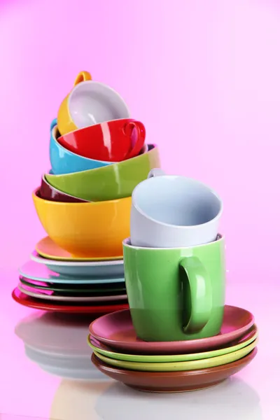 Mountain colorful dishes on pink background — Stock Photo, Image