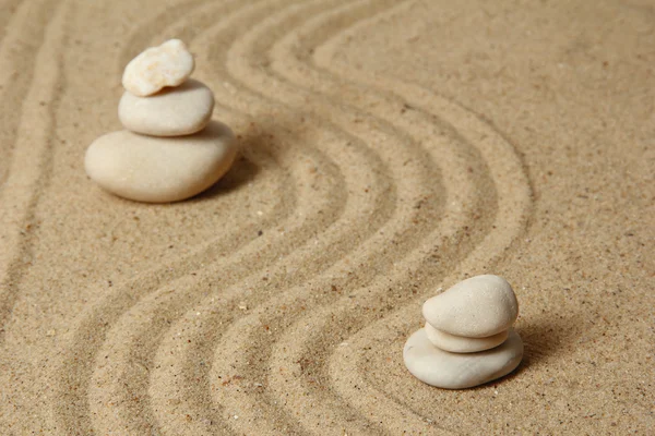 Zen garden with raked sand and round stones close up — Stock Photo, Image