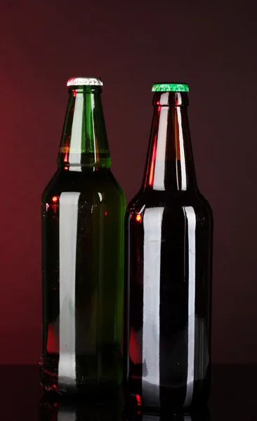 Bottles of beer on brown background Royalty Free Stock Images