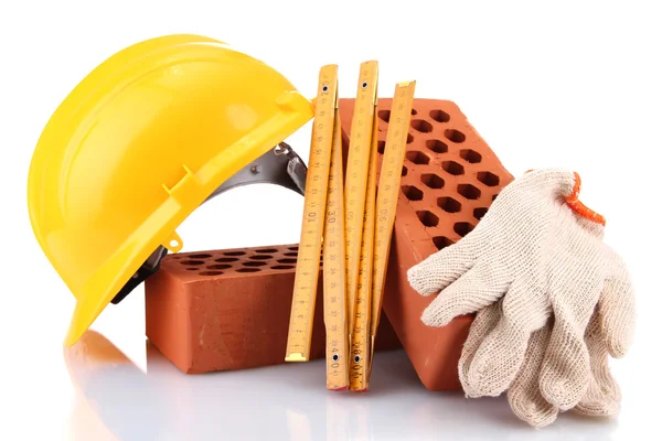 Helmet, roulette, bricks and gloves isolated on white — Stock Photo, Image