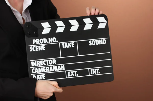 Movie production clapper board on color background — Stock Photo, Image