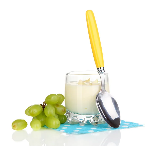 Delicious yogurt in glass with grapes isolated on white — Stock Photo, Image