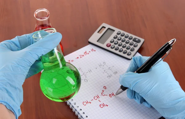 Hand scientist writing formulas — Stock Photo, Image