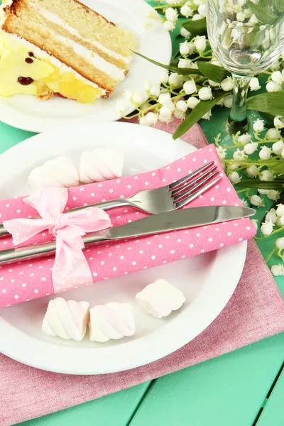 Table setting in white and pink tones on color wooden background — Stock Photo, Image