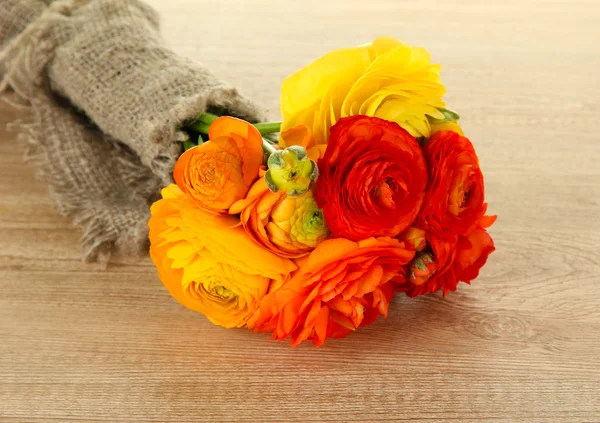 Ranunculus (persian buttercups) on wooden background — Stock Photo, Image