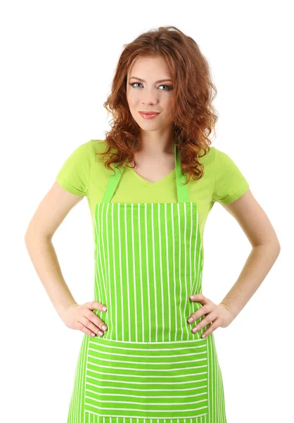 Mladá žena nosí kuchyňské zástěry, izolované na bílém — Stock fotografie