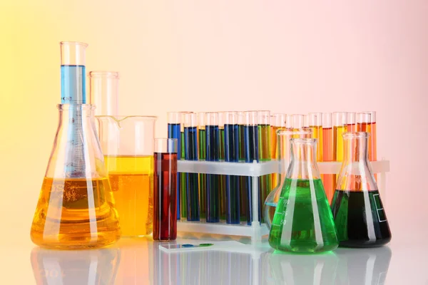 Colorful test tubes on light background — Stock Photo, Image