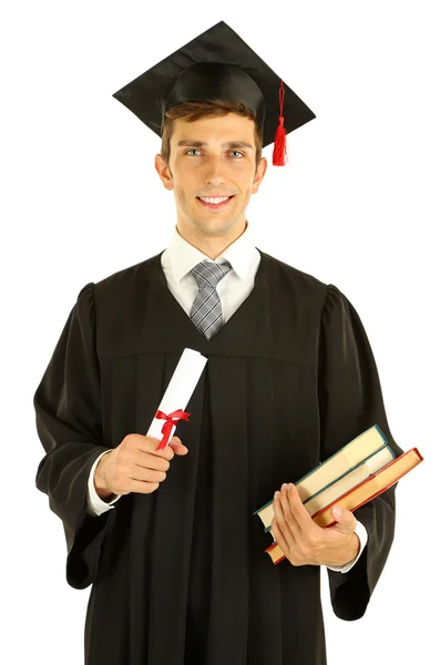 Young graduation man holding diploma and books, isolated on white — Stock Photo, Image