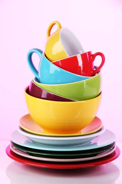 Mountain colorful dishes on pink background — Stock Photo, Image