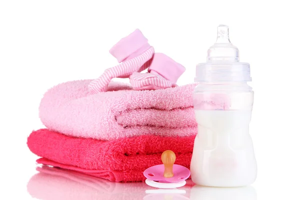 Bottle for milk with towels and nipple isolated on white — Stock Photo, Image