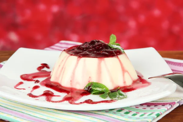 Panna Cotta with raspberry sauce, on bright background — Stock Photo, Image