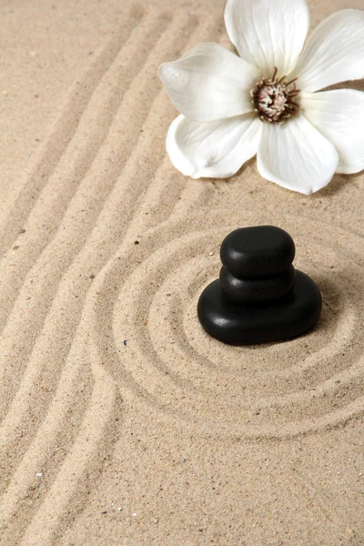 Zen garden with raked sand and round stones close up — Stock Photo, Image