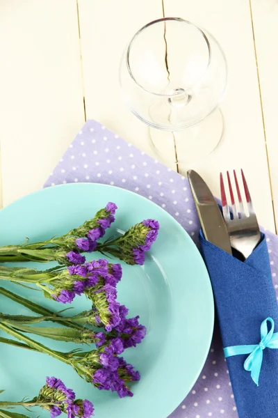 Table serving on a wooden background — Stock Photo, Image