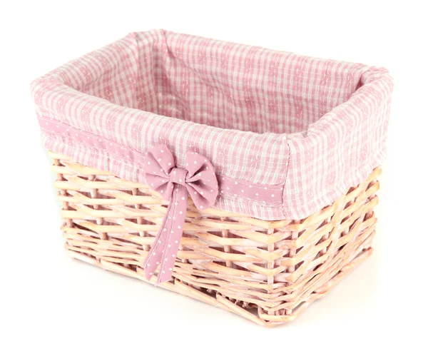 Wicket cesta com tecido rosa e arco, isolado em branco — Fotografia de Stock