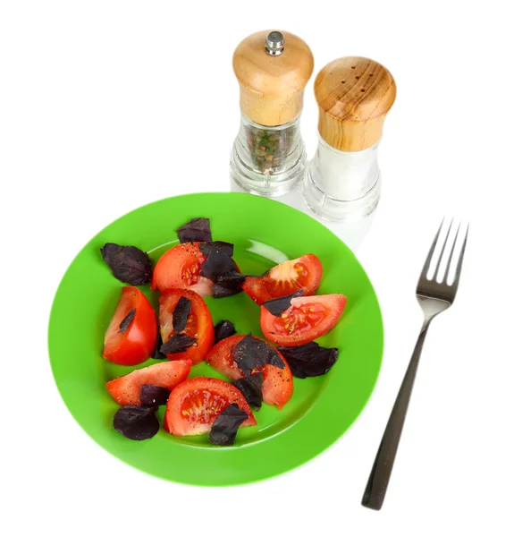 Salad of fresh tomatoes with basil leaves isolated on white — Stock Photo, Image