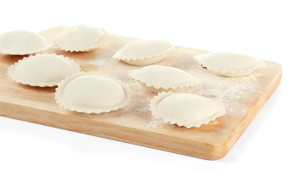 Raw dumplings on wooden desk, isolated on white — Stock Photo, Image