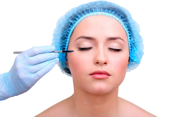 Cosmetic surgery with scalpel on young woman close up — Stock Photo, Image