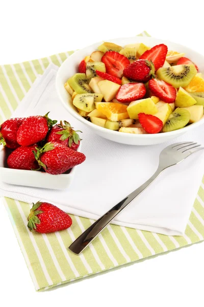 Useful fruit salad of fresh fruits and berries in bowl isolated on white — Stock Photo, Image