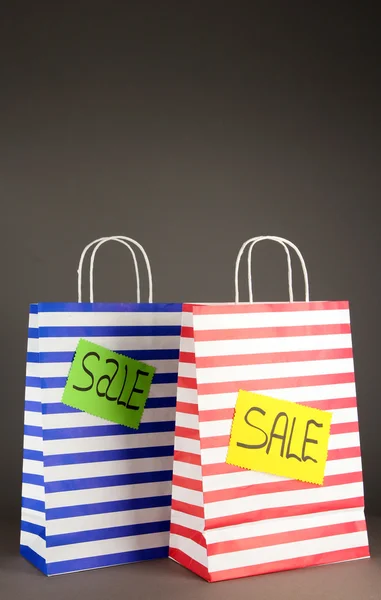 Striped bags on gray background — Stock Photo, Image