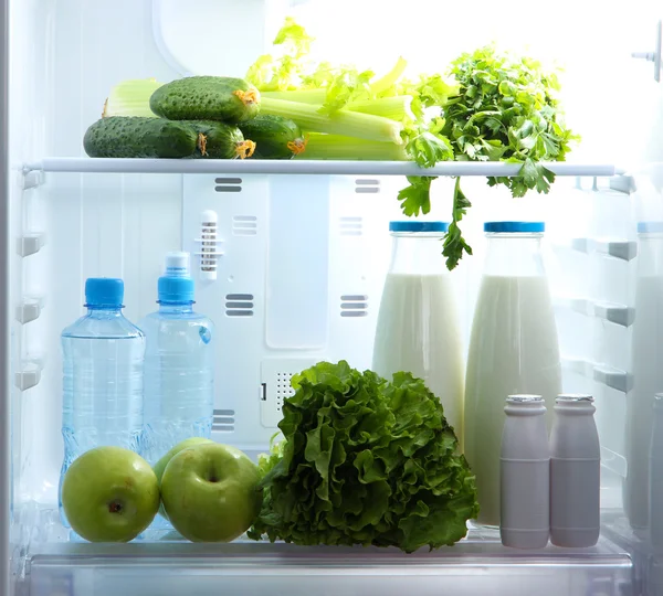 Open refrigerator with vegetarian food — Stock Photo, Image