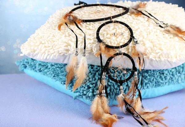 Beautiful dream catcher and pillows on blue background — Stock Photo, Image