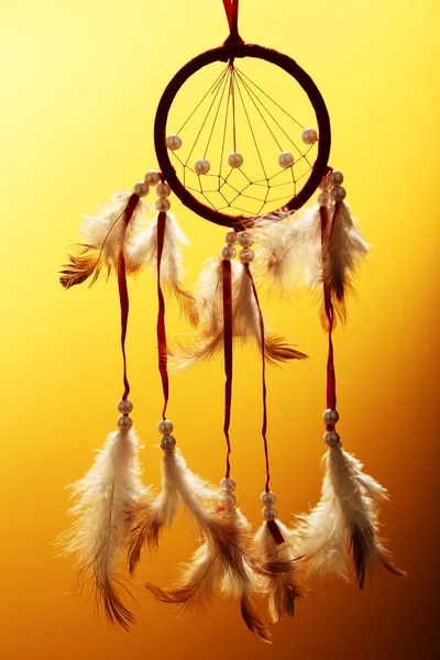 Beautiful dream catcher on yellow background — Stock Photo, Image