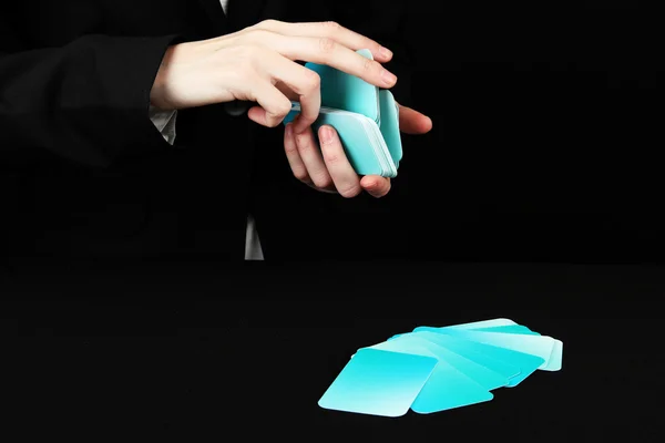 Hand with business cards. Concept: Business like poker game. Isolated on black — Stock Photo, Image