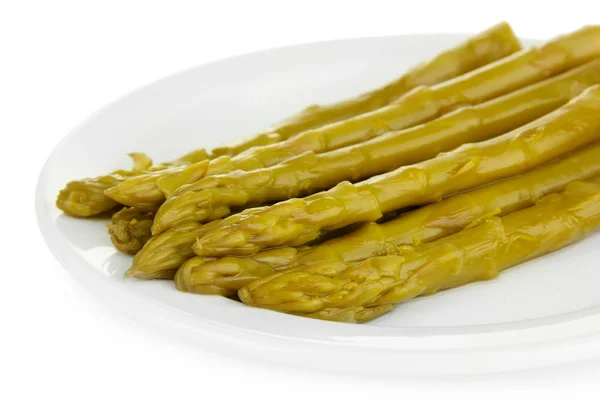 Asparagi su piastra, isolati su bianco — Foto Stock