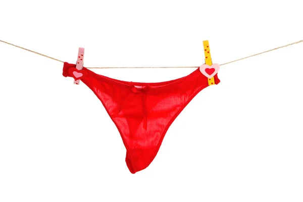 Women's panties hanging on rope isolated on white — Stock Photo, Image