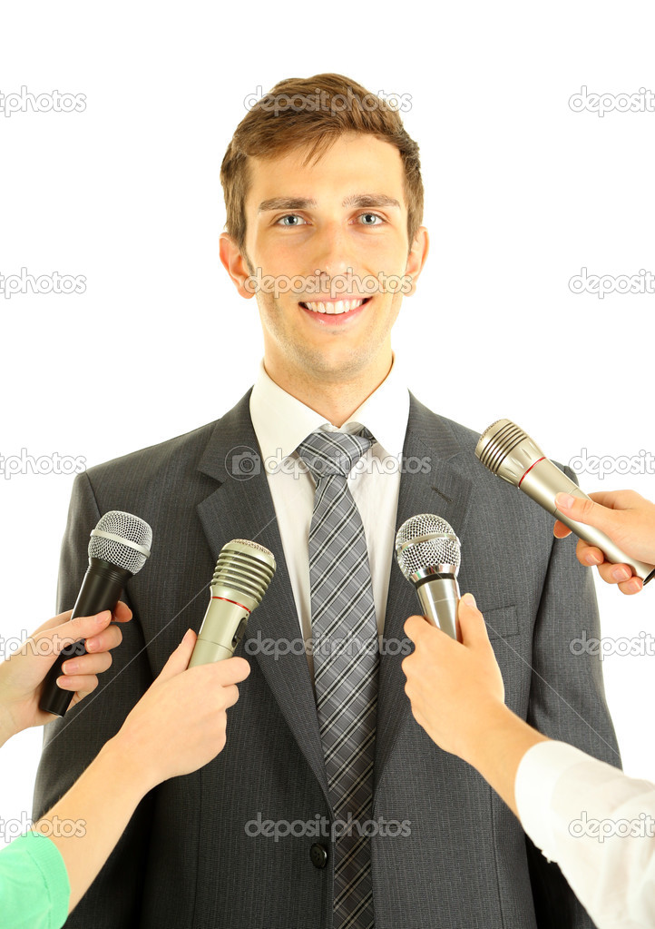 Interview with a young businessman, isolated on white