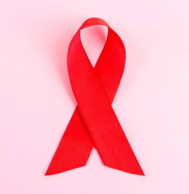 kırmızı kurdele HIV, AIDS, pembe arka plan