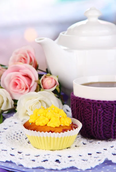 Delicious beautiful cupcake on dining table on room background — Stock Photo, Image