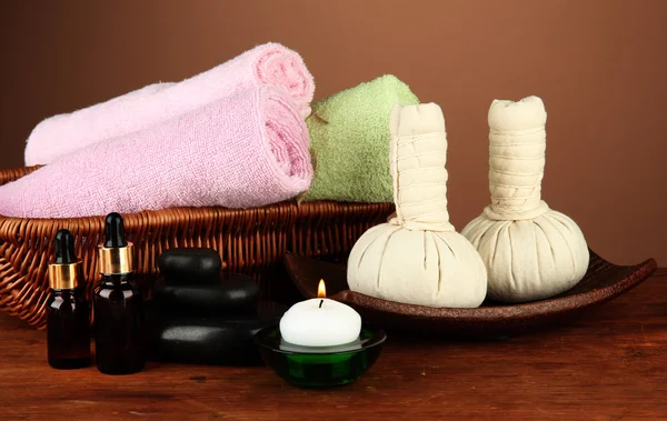 Textile massage spa equipment on a brown background — Stock Photo, Image