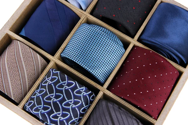 Neckties in wooden box close-up — Stock Photo, Image